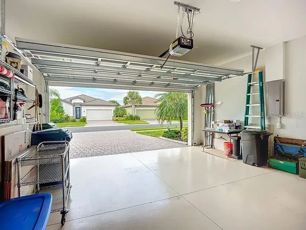 a open kitchen with stainless steel appliances granite countertop a sink and a stove