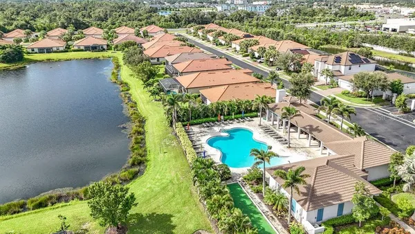 an aerial view of a house with a lake view