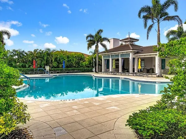 a view of a lake with a swimming pool and a outdoor space