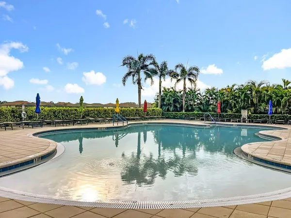 a swimming pool with outdoor seating