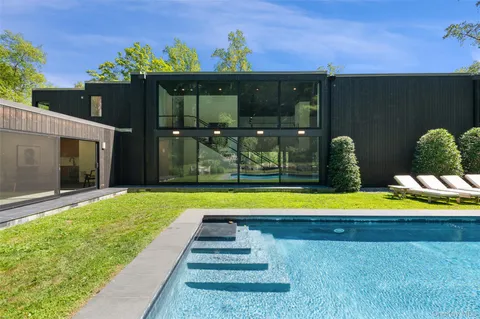 a view of swimming pool with a backyard
