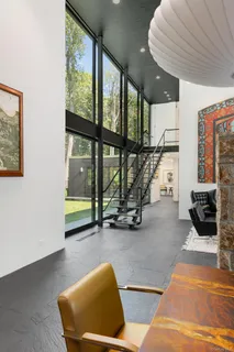 a view of living room with furniture and floor to ceiling window