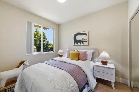 a bedroom with bed and window