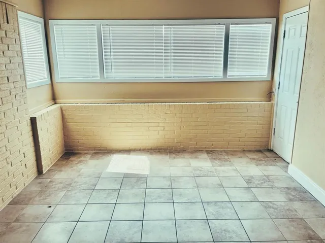 a view of a bathroom with bathtub