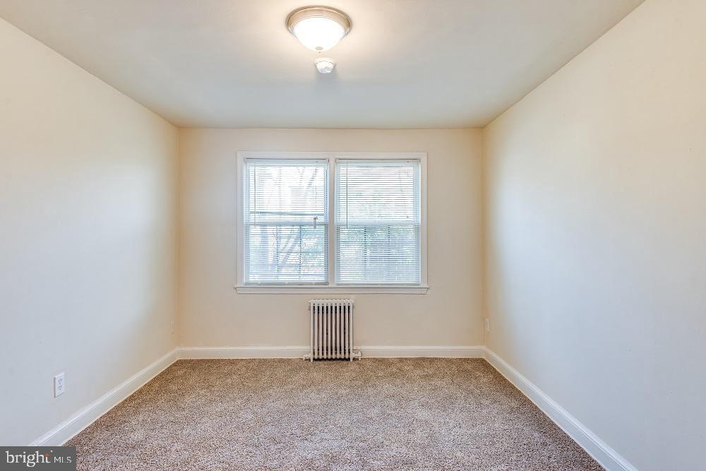 3320 11th Place Southeast, Unit 101 Washington, DC 20032 - Photo 8 of 8 an empty room with a window