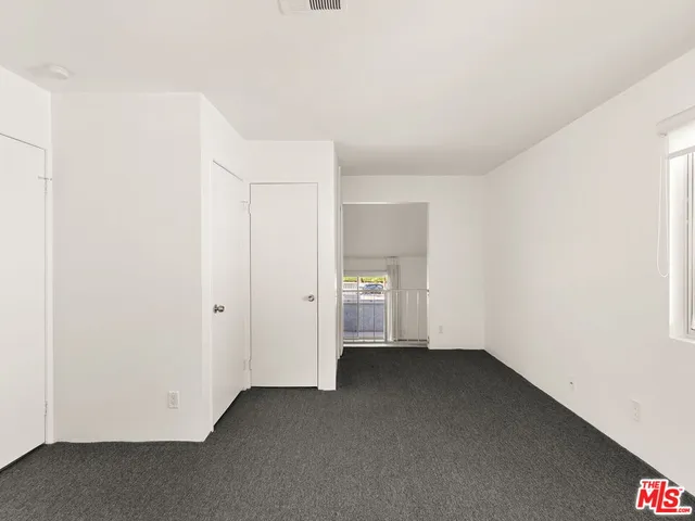 a view of storage and utility room with washer and dryer