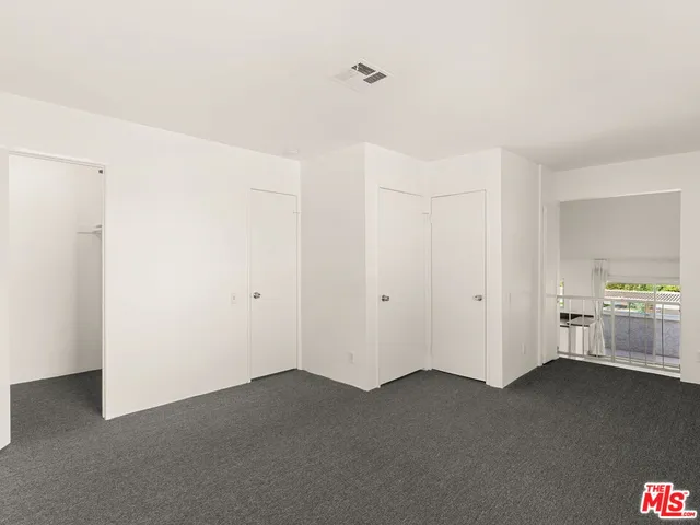 a view of small space with racks on the wall