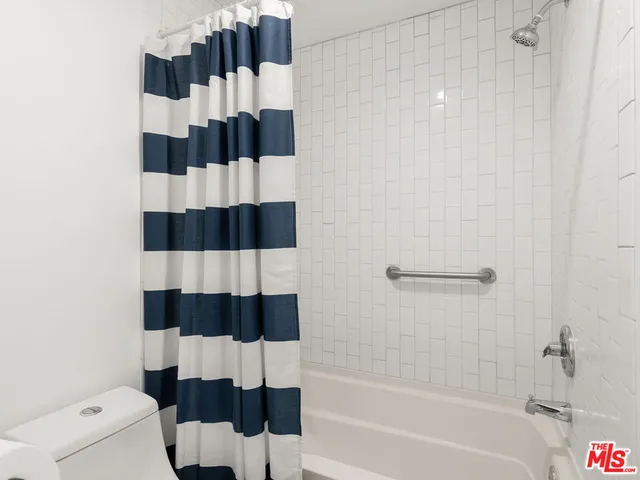 a view of a chairs with potted plants