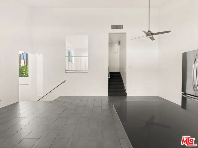 a view of an empty room and a window