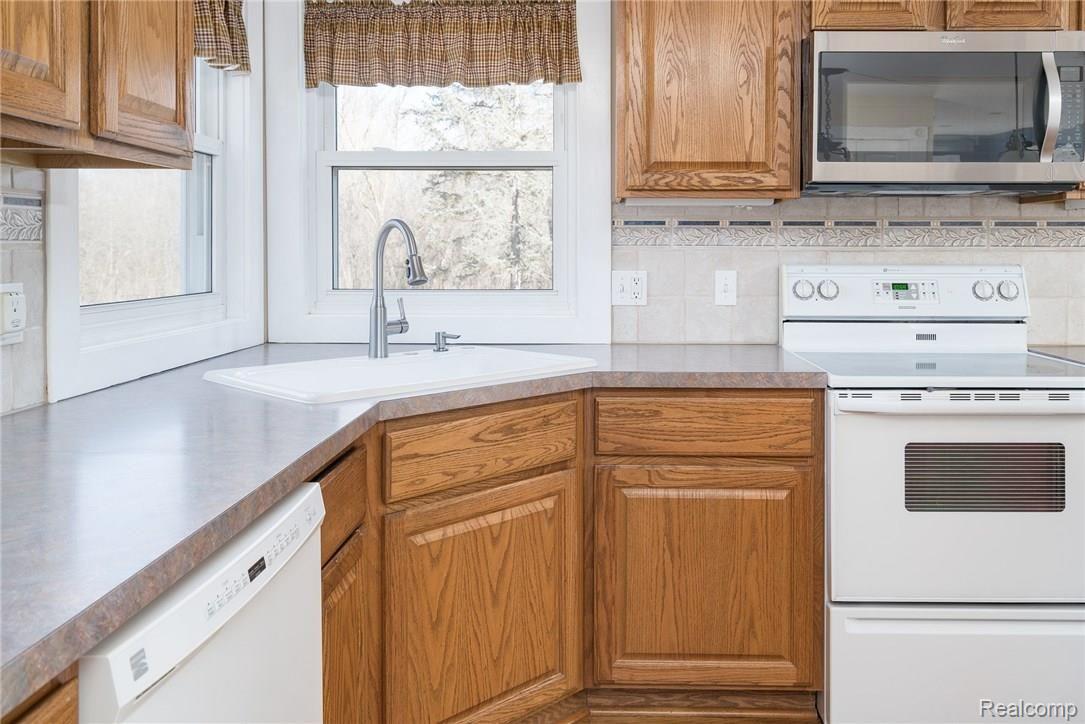 1290 7 Mile Road Whitmore Lake, MI 48189 - Photo 10 of 34 Kitchen Corner Sink and Windows