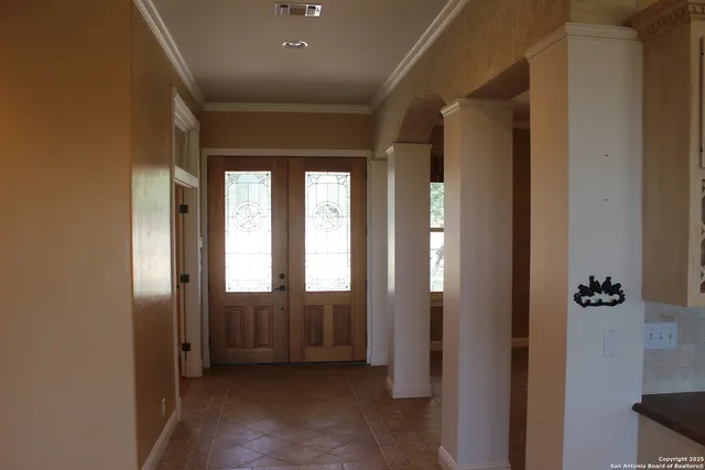 a view of kitchen with kitchen island and stainless steel appliances