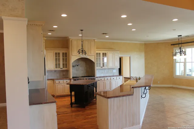 an empty room with a fireplace and window
