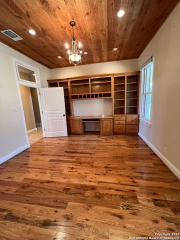 a view of a swimming pool with a yard