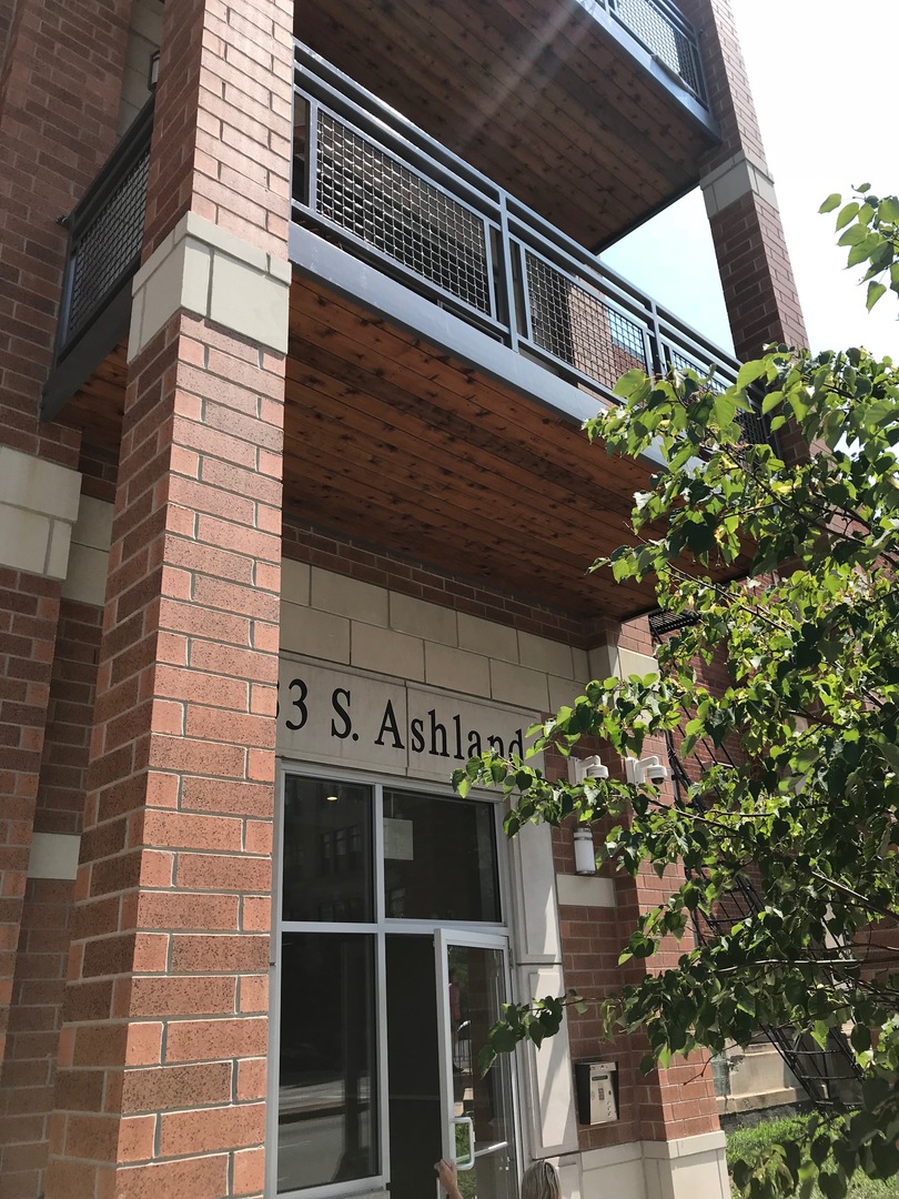 a front view of a house with a plants
