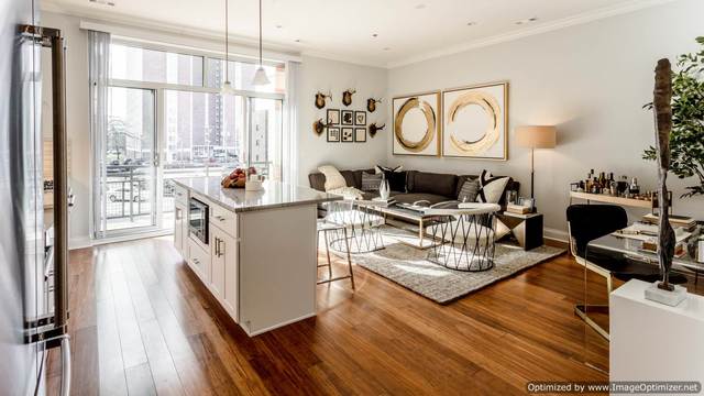 Undisclosed Address Chicago, IL 60607 - Photo 3 of 16 a living room with furniture and a large window