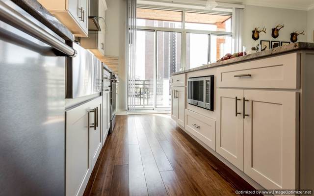 Undisclosed Address Chicago, IL 60607 - Photo 6 of 16 a view of a hallway with wooden floor and staircase