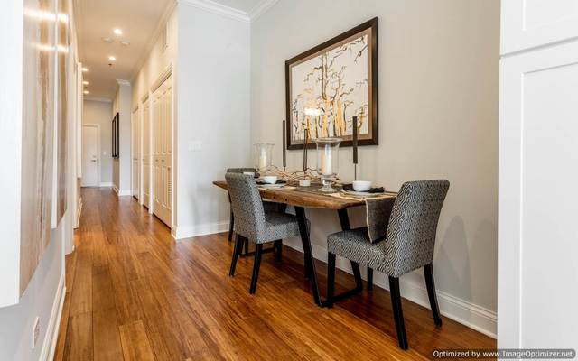 Undisclosed Address Chicago, IL 60607 - Photo 8 of 16 a dining room with furniture and wooden floor