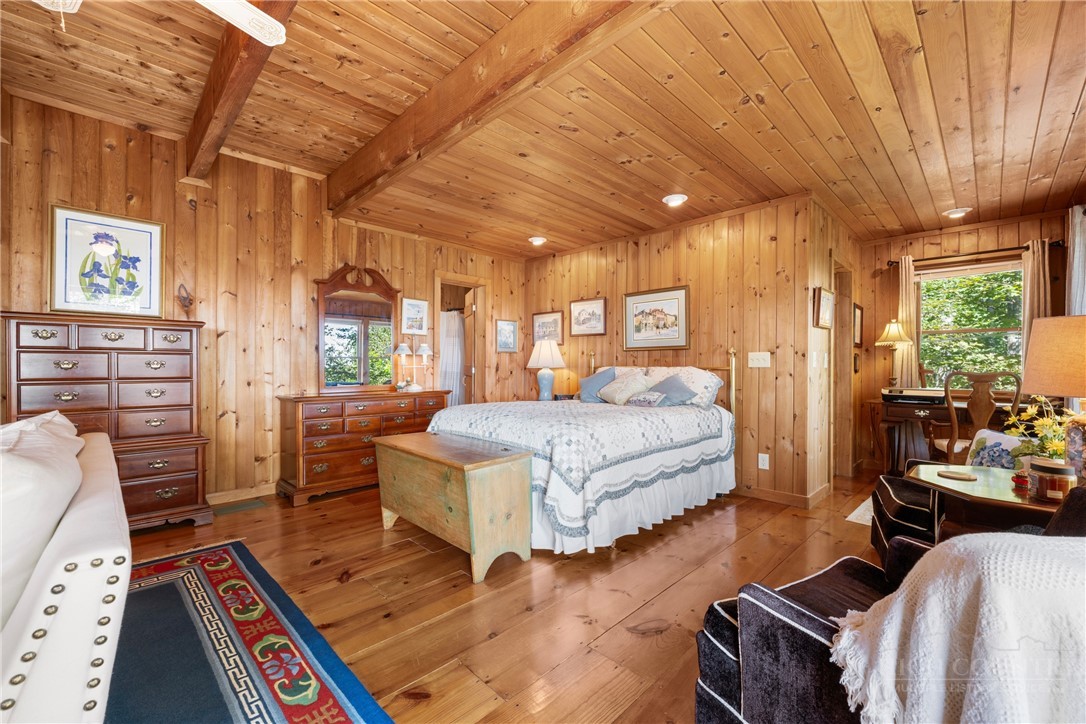2177 Homestead Road Todd, NC 28684 - Photo 12 of 49 a bedroom with a bed wooden floor and window