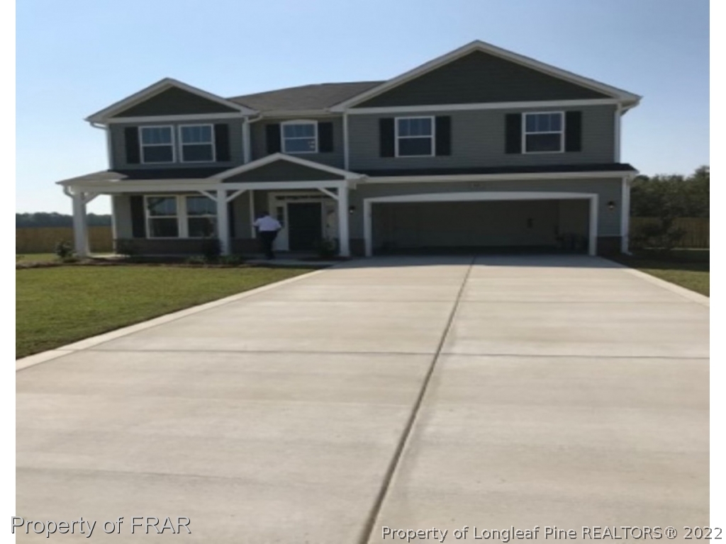 95 Mill Ridge Court Godwin, NC 28344 - Photo 1 of 2 a front view of a house with a yard