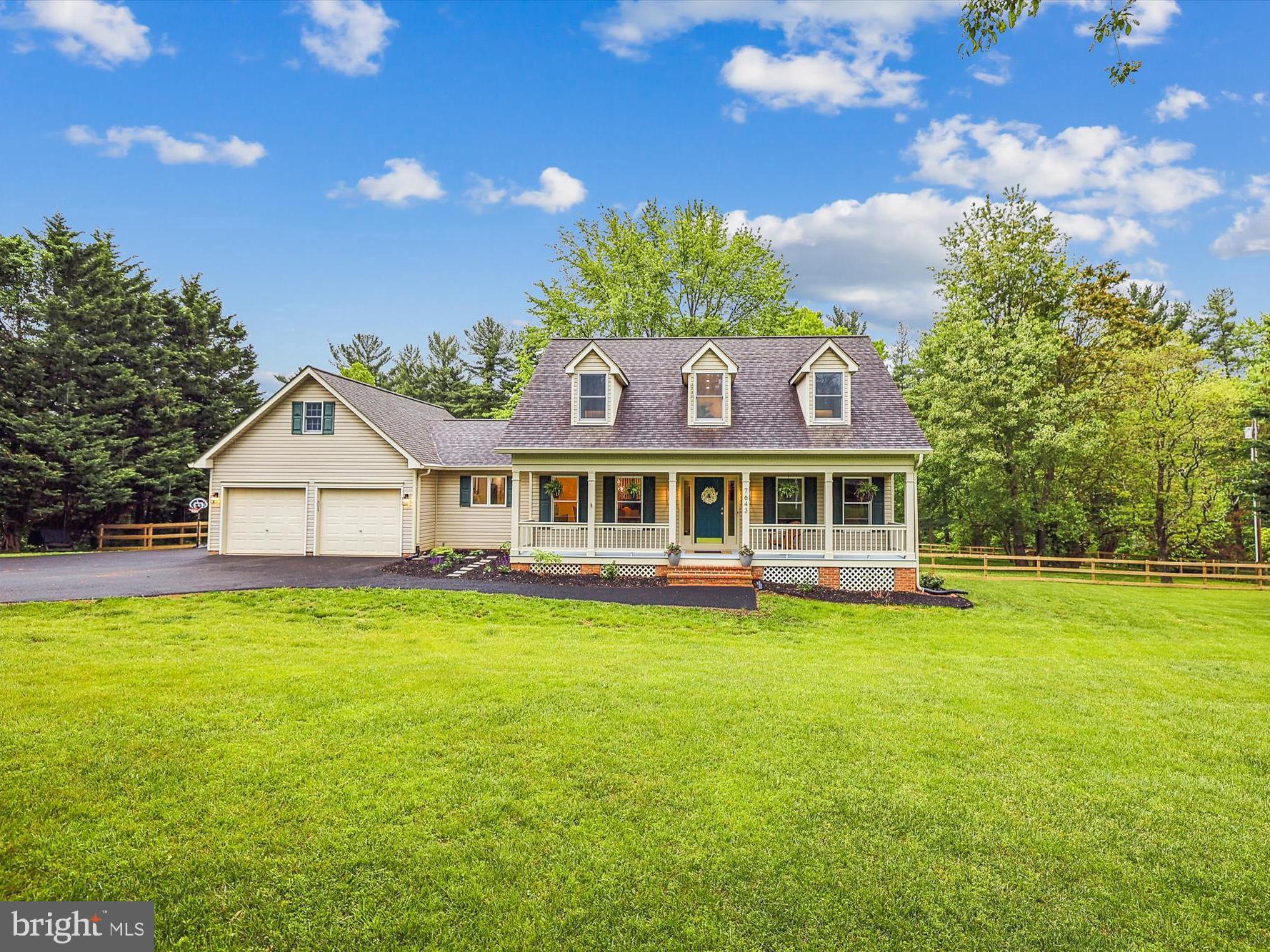 7643 Old Receiver Road Frederick, MD 21702 - Photo 1 of 82 a view of a house with a big yard and large trees