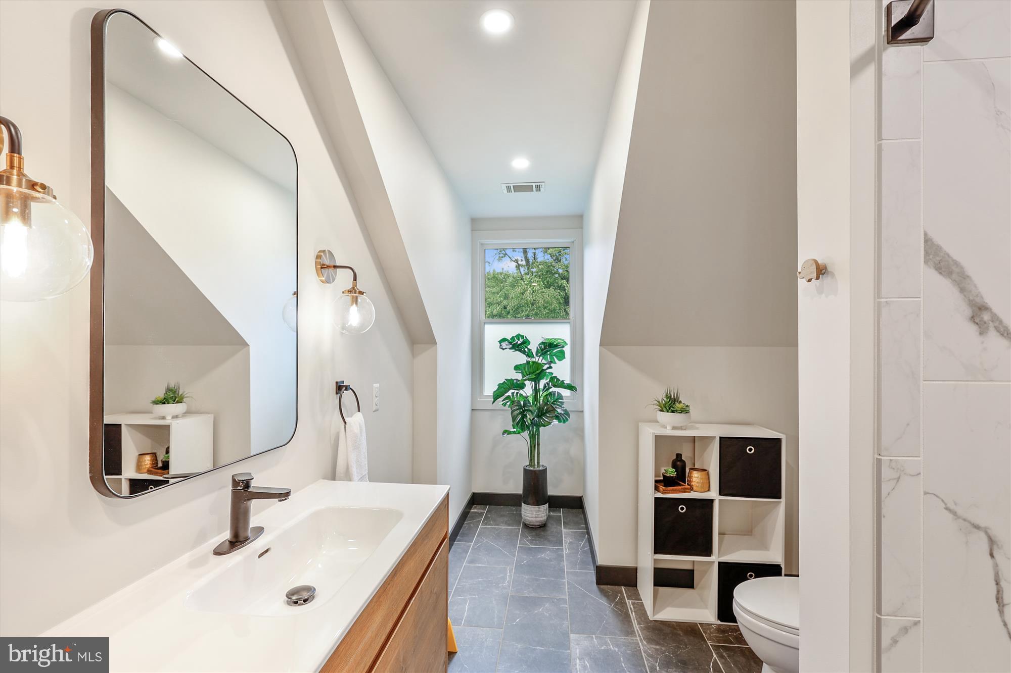 7643 Old Receiver Road Frederick, MD 21702 - Photo 45 of 82 a bathroom with a sink and a mirror