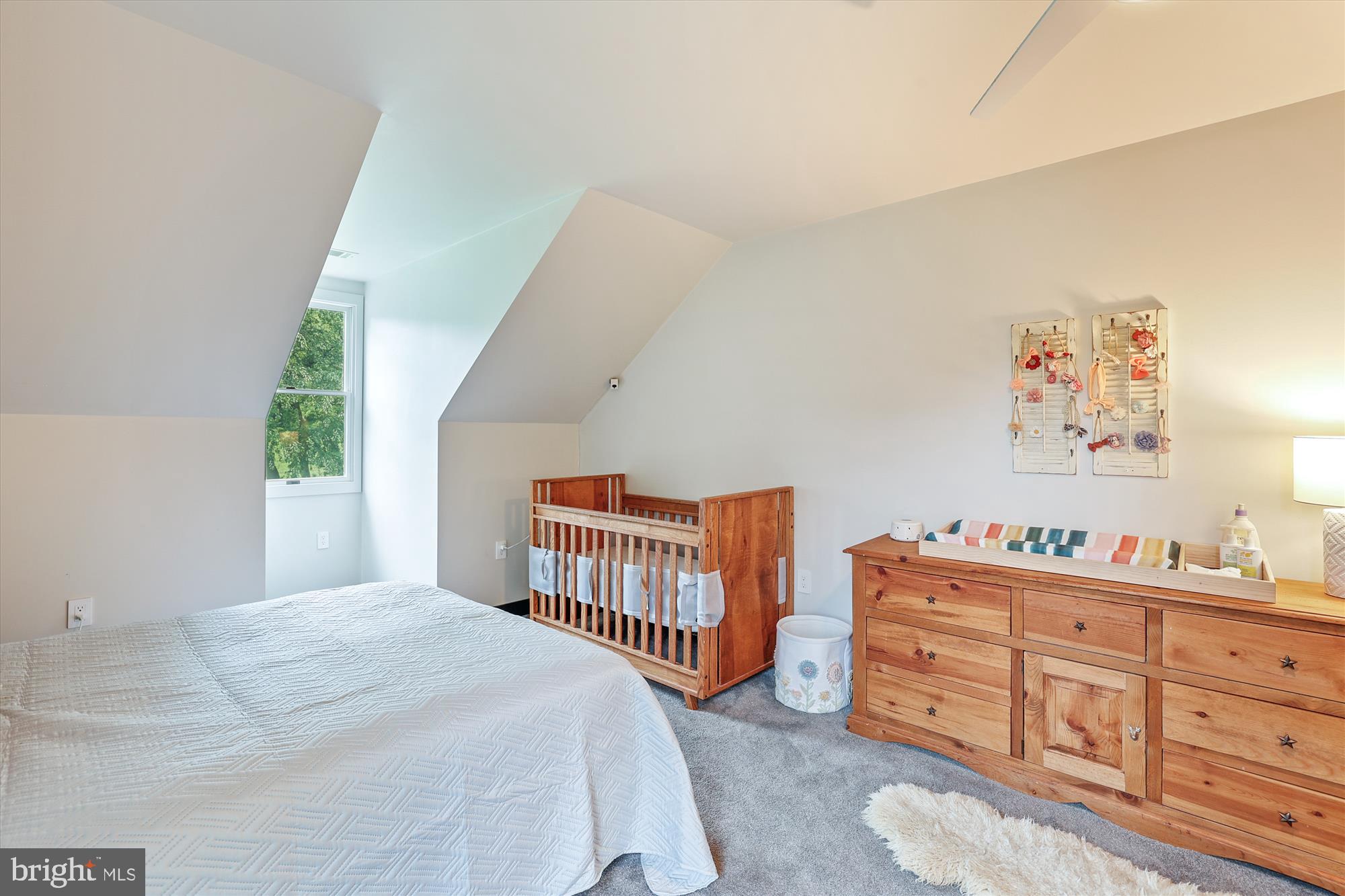 7643 Old Receiver Road Frederick, MD 21702 - Photo 50 of 82 a bedroom with a bed and a baby crib