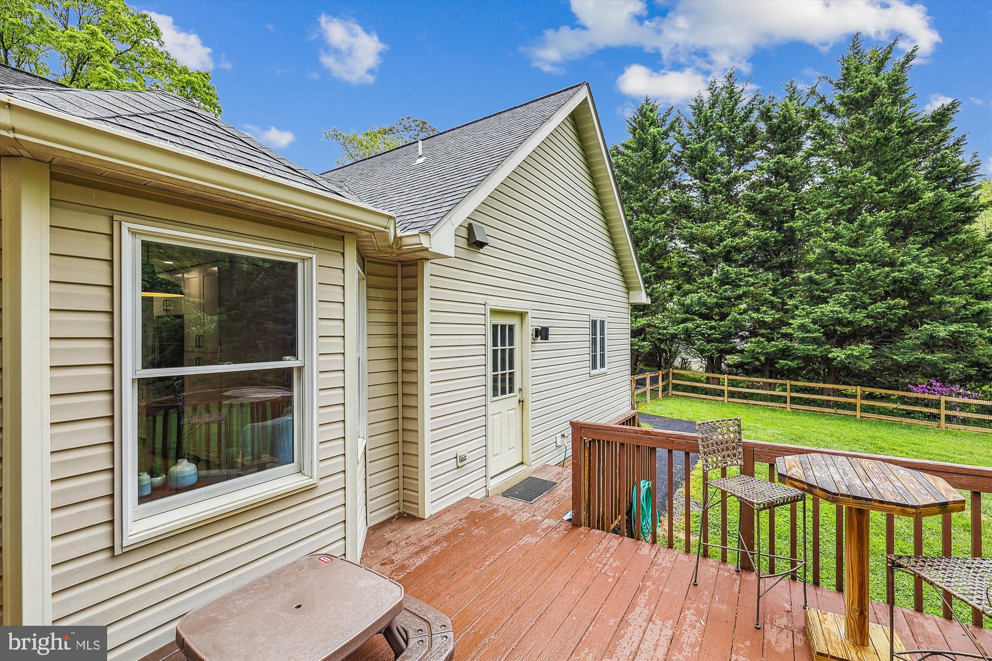 7643 Old Receiver Road Frederick, MD 21702 - Photo 70 of 82 a view of a house with wooden deck and a floor to ceiling window