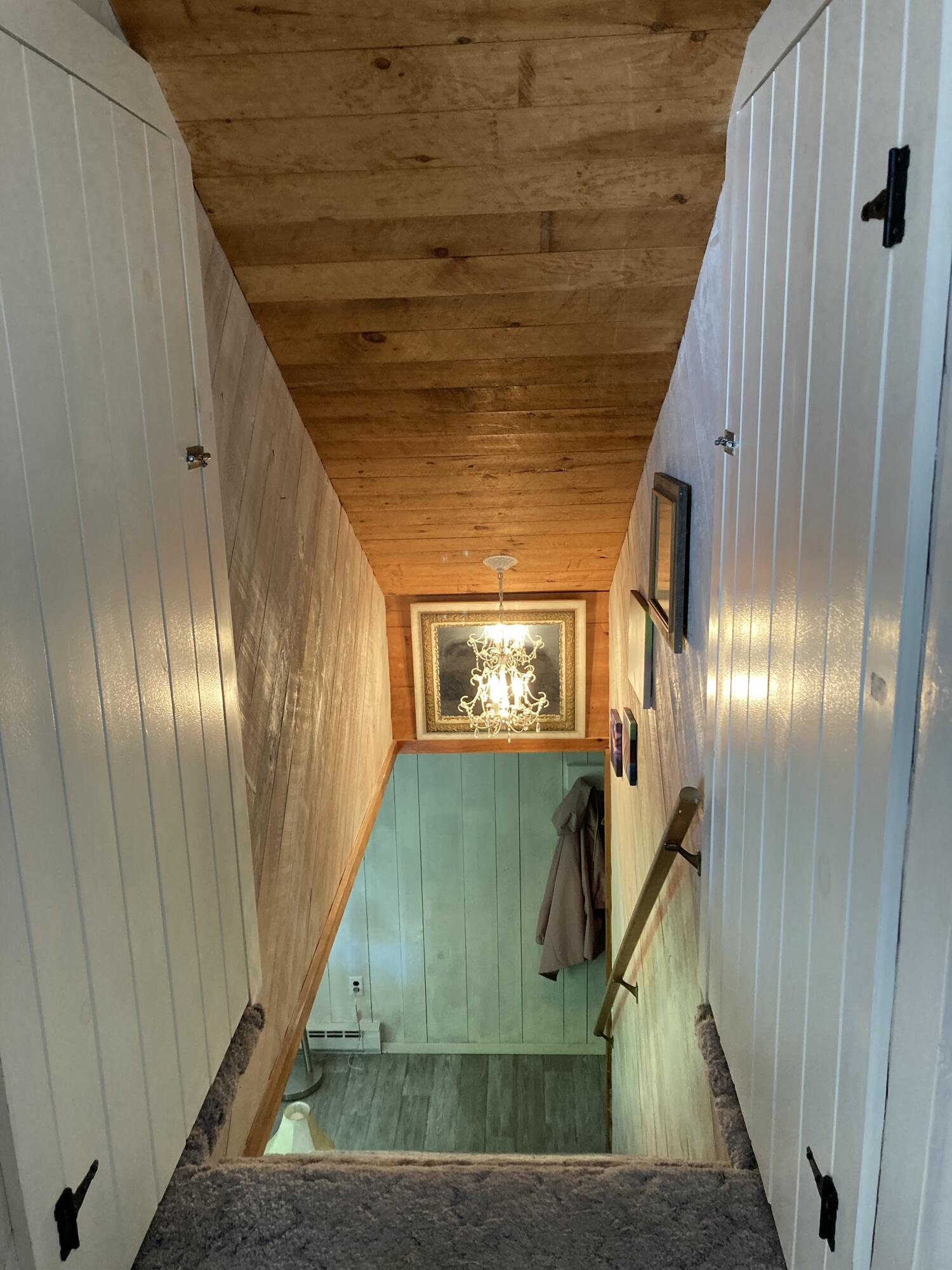 969 Surry Road Surry, ME 04684 - Photo 23 of 41 Stairwell to second floor.