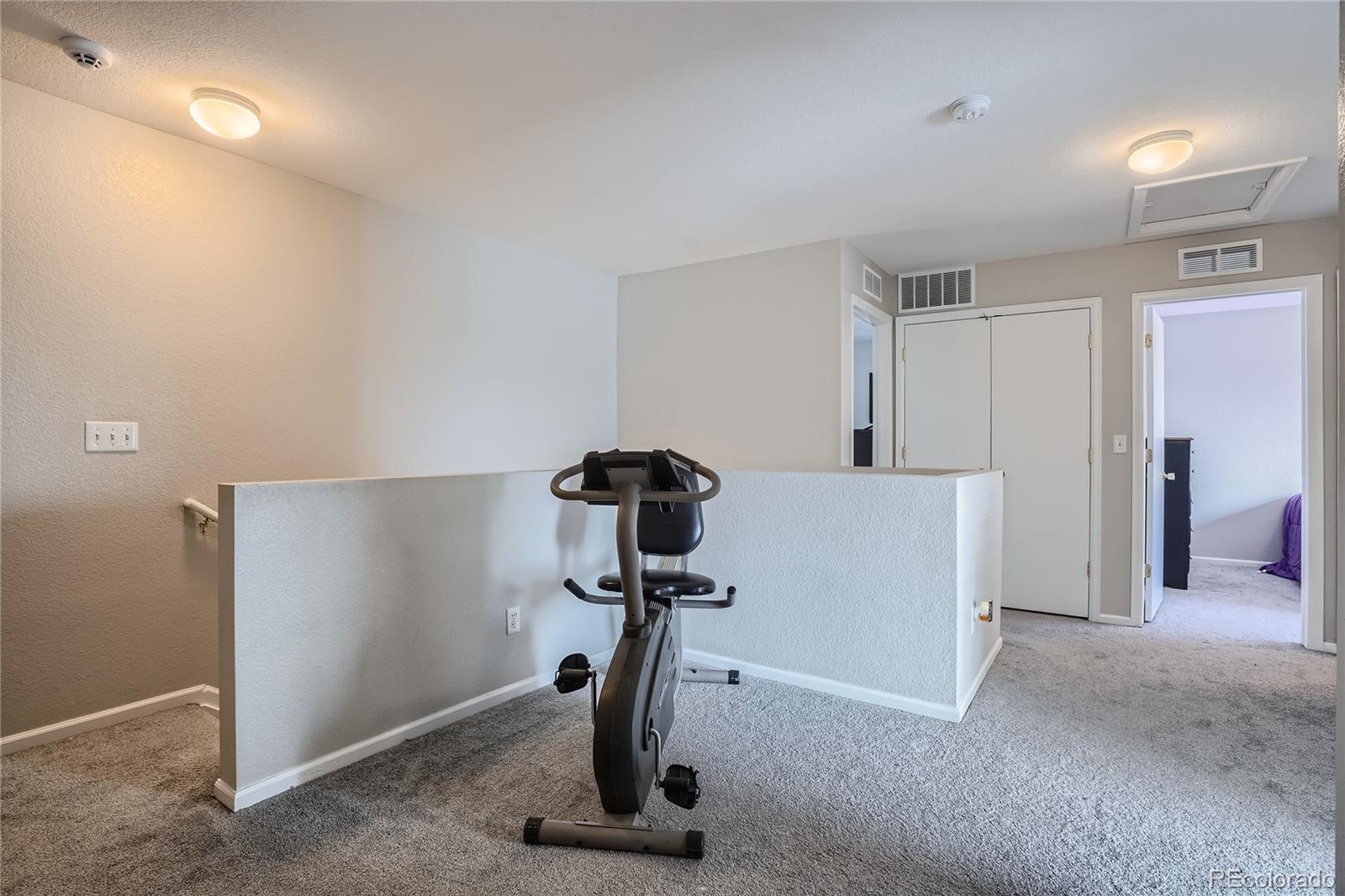 4725 Andes Street Denver, CO 80249 - Photo 20 of 27 a view of a room with gym equipment