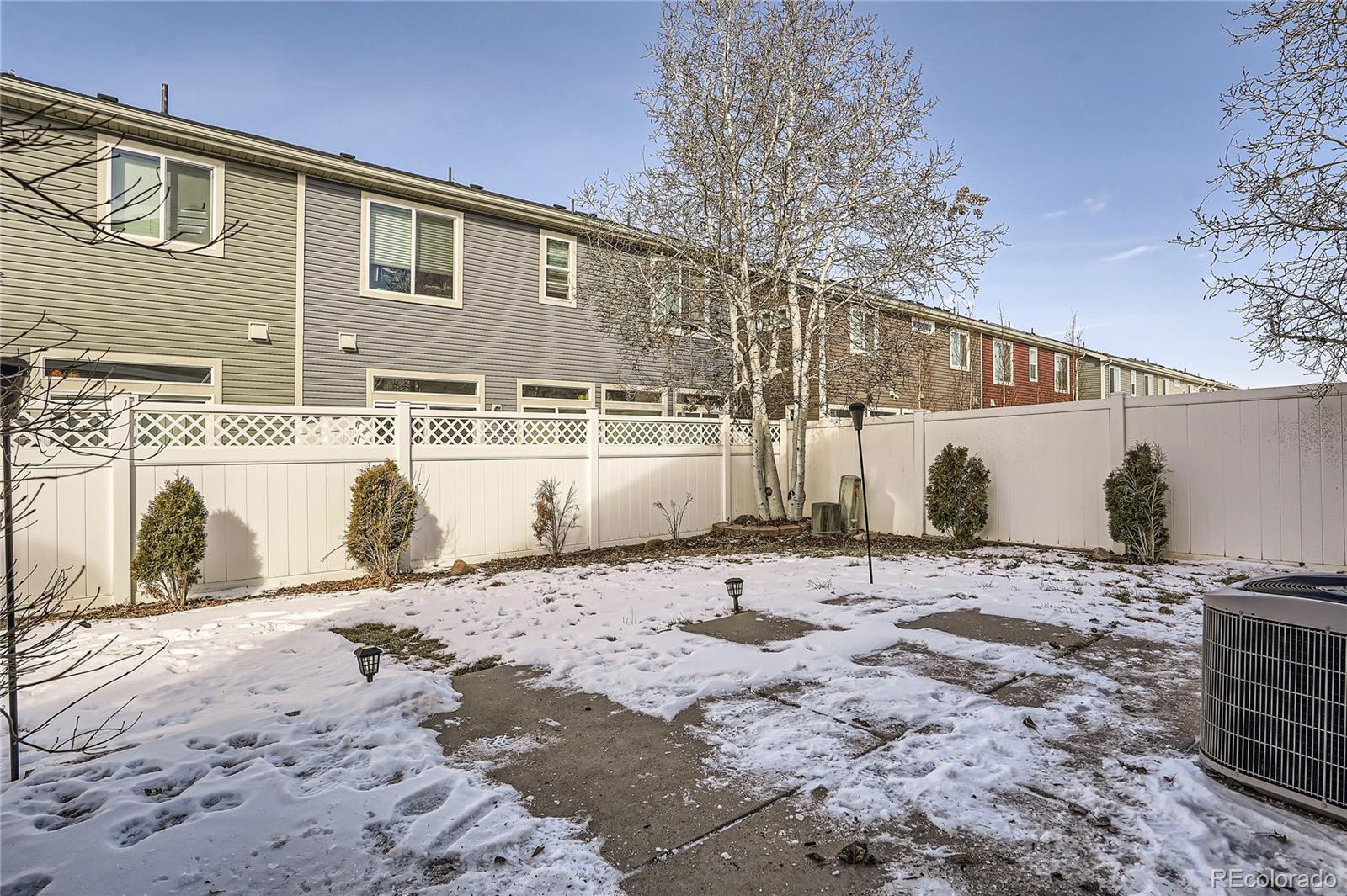 4725 Andes Street Denver, CO 80249 - Photo 24 of 27 a view of a house with a snow on the road