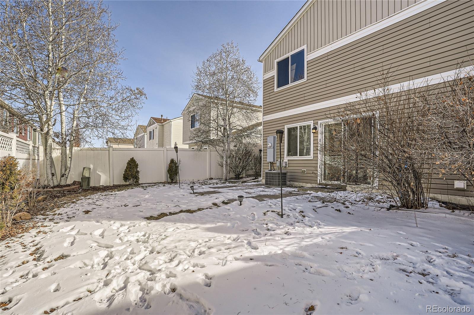 4725 Andes Street Denver, CO 80249 - Photo 27 of 27 a view of a yard with a house
