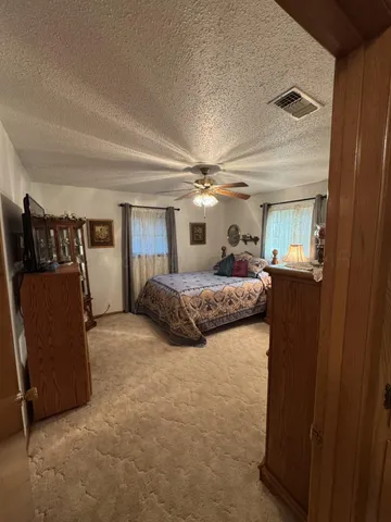 a bedroom with furniture and a window