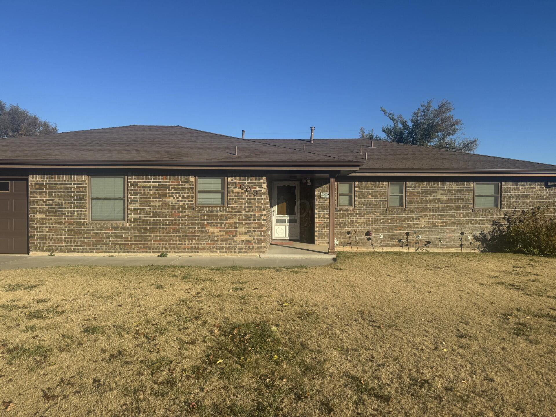 1009 P Avenue Sunray, TX 79086 - Photo 10 of 10 a view of a yard with an outdoor space