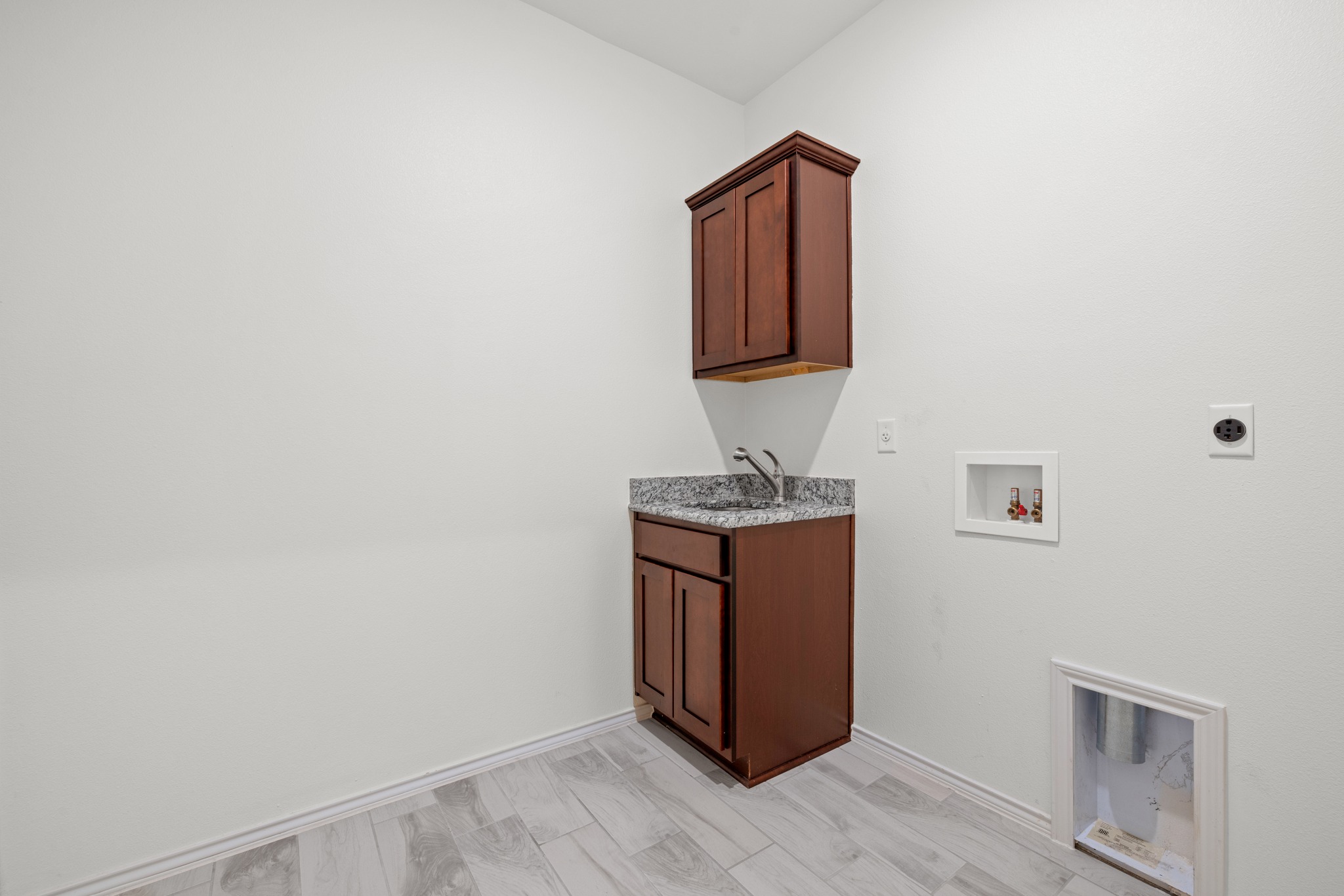 6019 Monza Drive Temple, TX 76502 - Photo 29 of 40 Laundry area with cabinet space, hookup for a washing machine, and hookup for an electric dryer