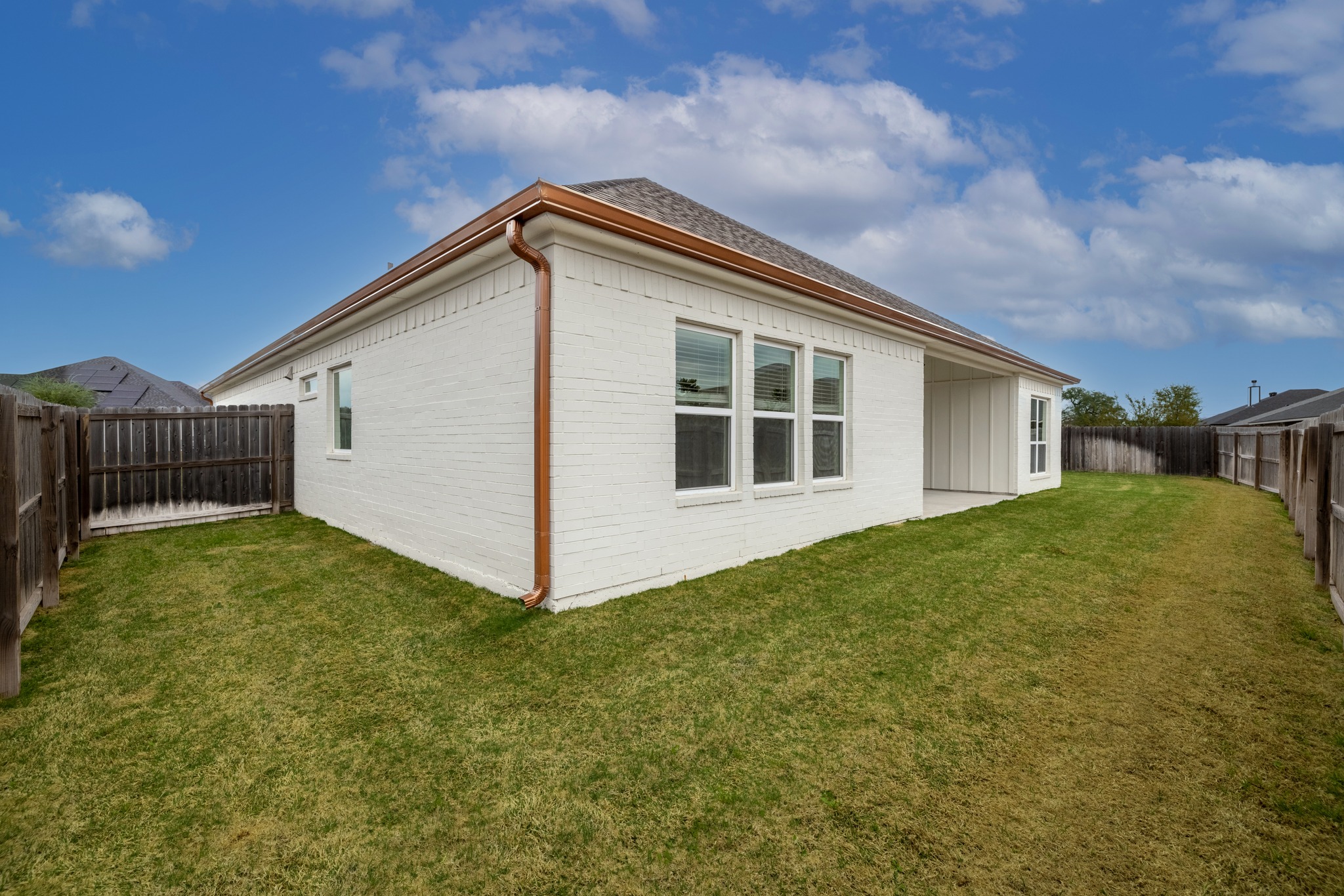 6019 Monza Drive Temple, TX 76502 - Photo 31 of 40 Rear view of property featuring a fenced backyard, brick siding, and a patio area