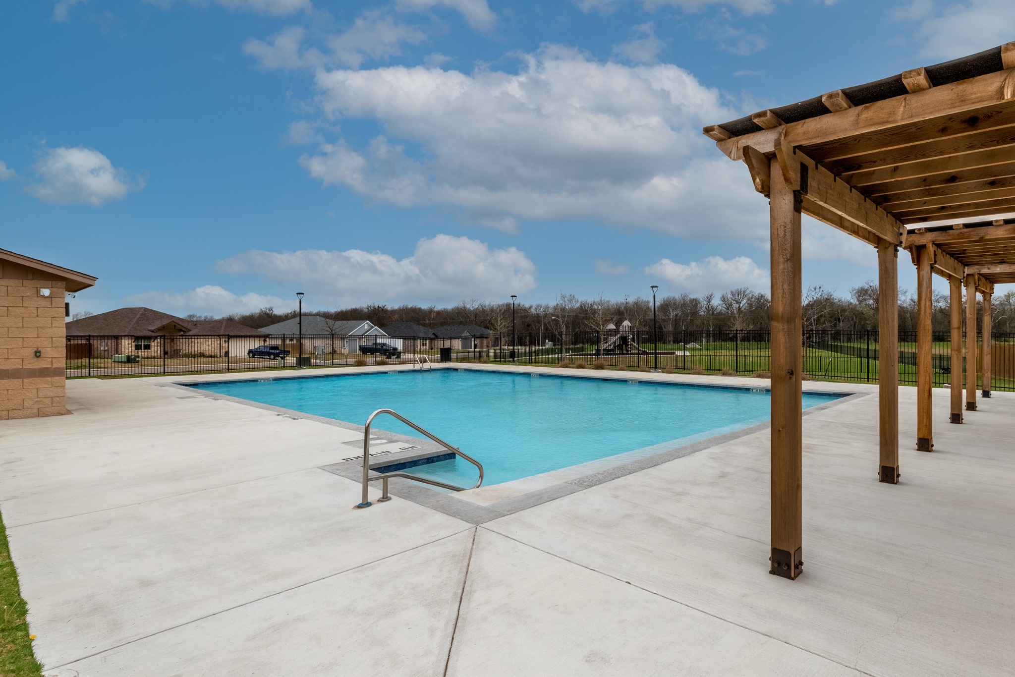 6019 Monza Drive Temple, TX 76502 - Photo 35 of 40 Community pool featuring a patio area and a pergola