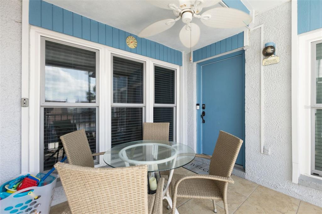 337 Rex Place, Unit G Madeira Beach, FL 33708 - Photo 2 of 40 a dining room with furniture and window