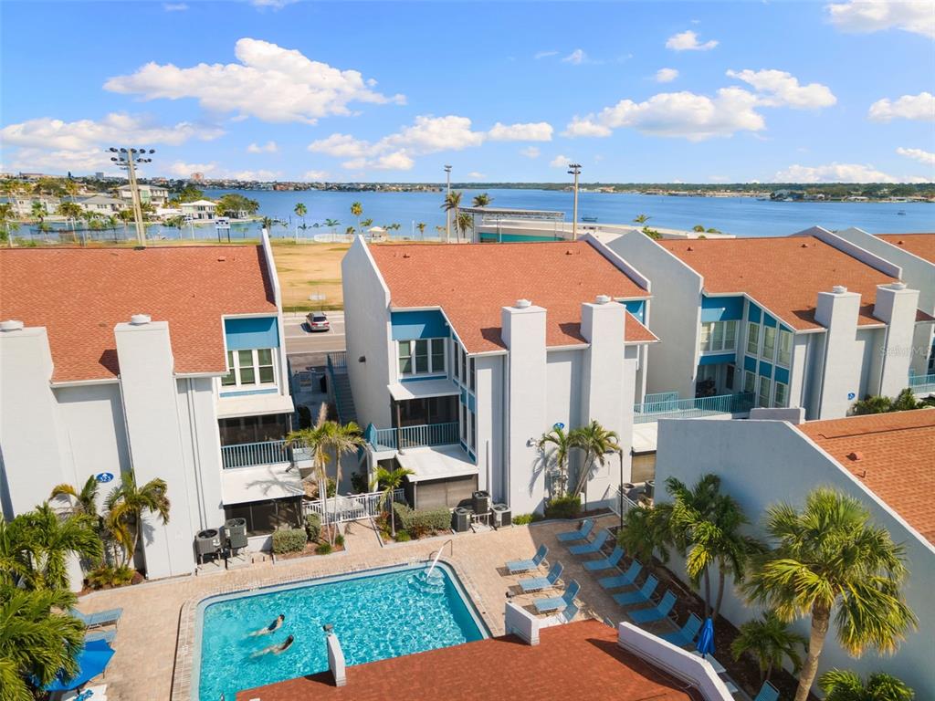 337 Rex Place, Unit G Madeira Beach, FL 33708 - Photo 38 of 40 a view of balcony with outdoor seating and city view