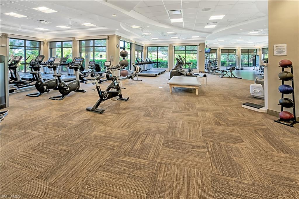 9572 Trevi Court, Unit 5015 Naples, FL 34113 - Photo 35 of 39 a view of a room with gym equipment