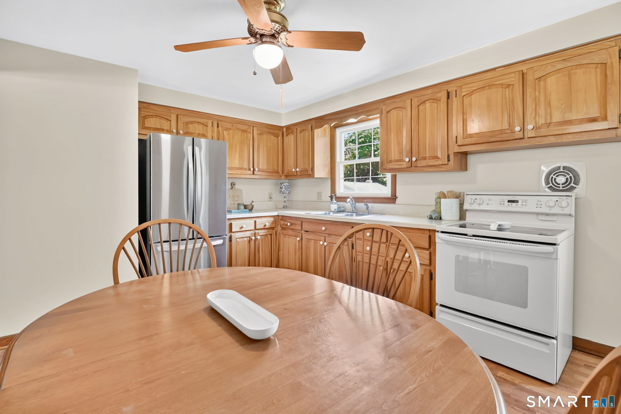 296 Phoenix Street Vernon, CT 06066 - Photo 10 of 34 a kitchen with refrigerator cabinets and a sink