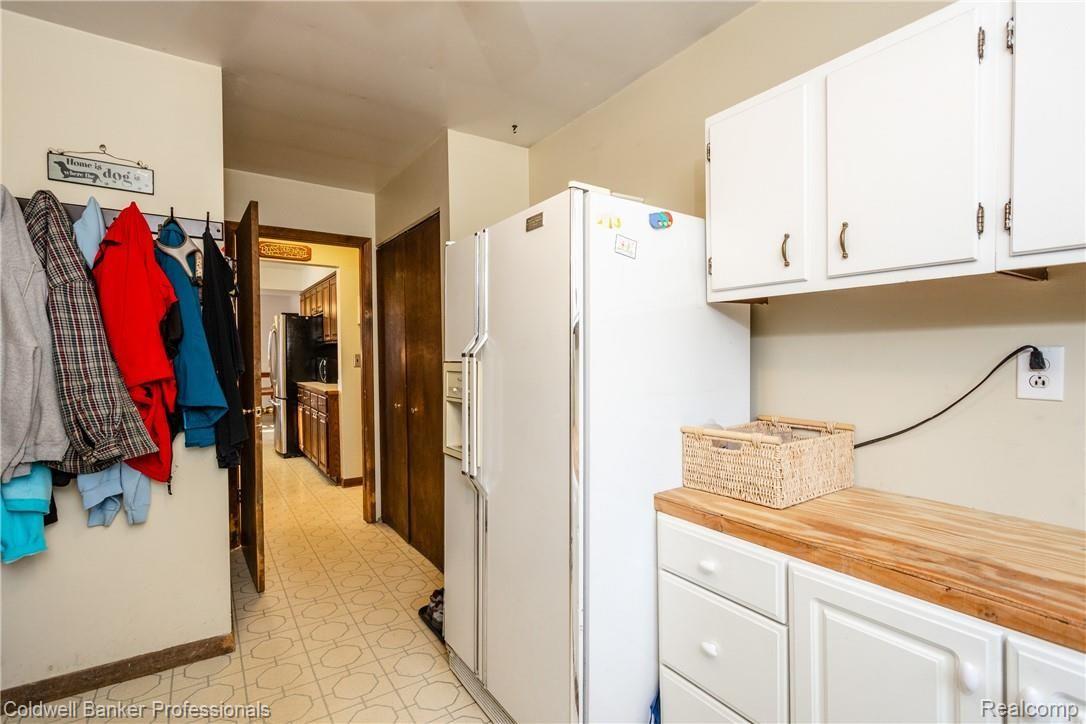 4777 Six Mile Road South Lyon, MI 48178 - Photo 37 of 71 Laundry has room for a second refrigerator, and a folding/storage area