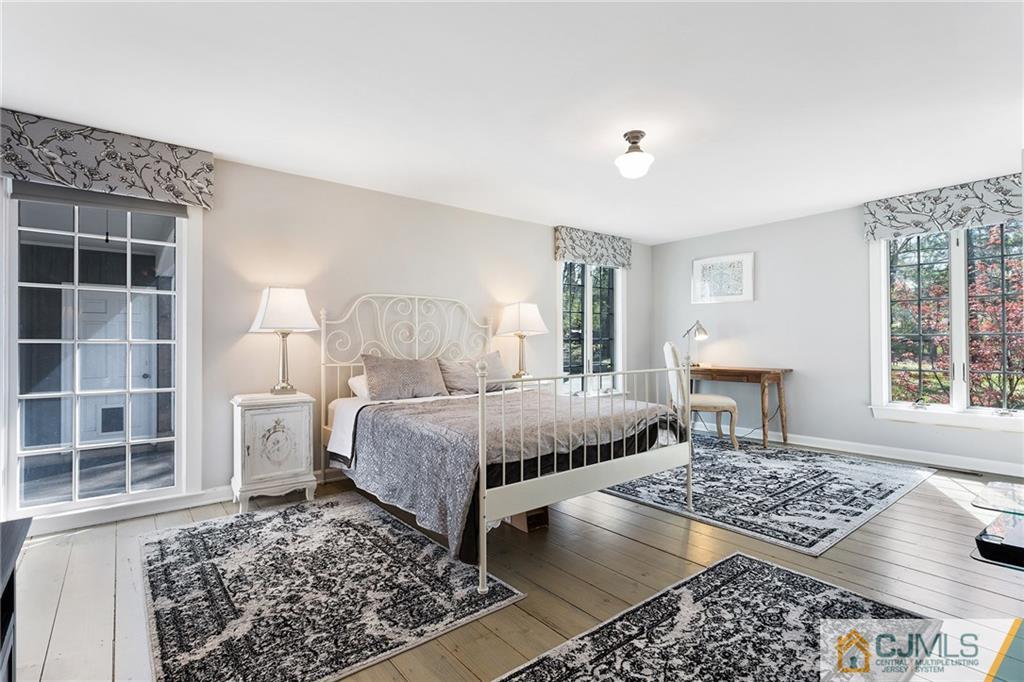 109 Rolling Hill Road Skillman, NJ 08558 - Photo 15 of 25 a bedroom with a bed and a window in it