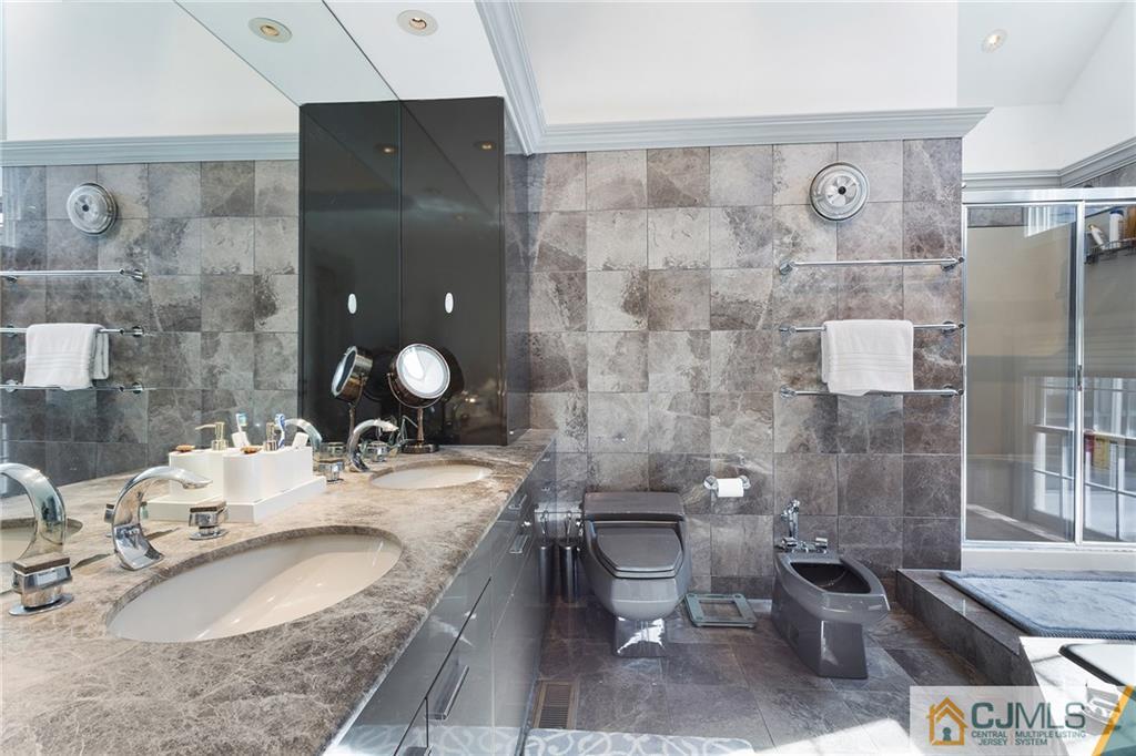 109 Rolling Hill Road Skillman, NJ 08558 - Photo 16 of 25 a bathroom with a granite countertop bathtub sink vanity mirror and toilet
