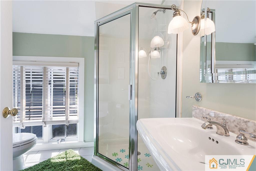 109 Rolling Hill Road Skillman, NJ 08558 - Photo 20 of 25 a bathroom with a sink and a mirror