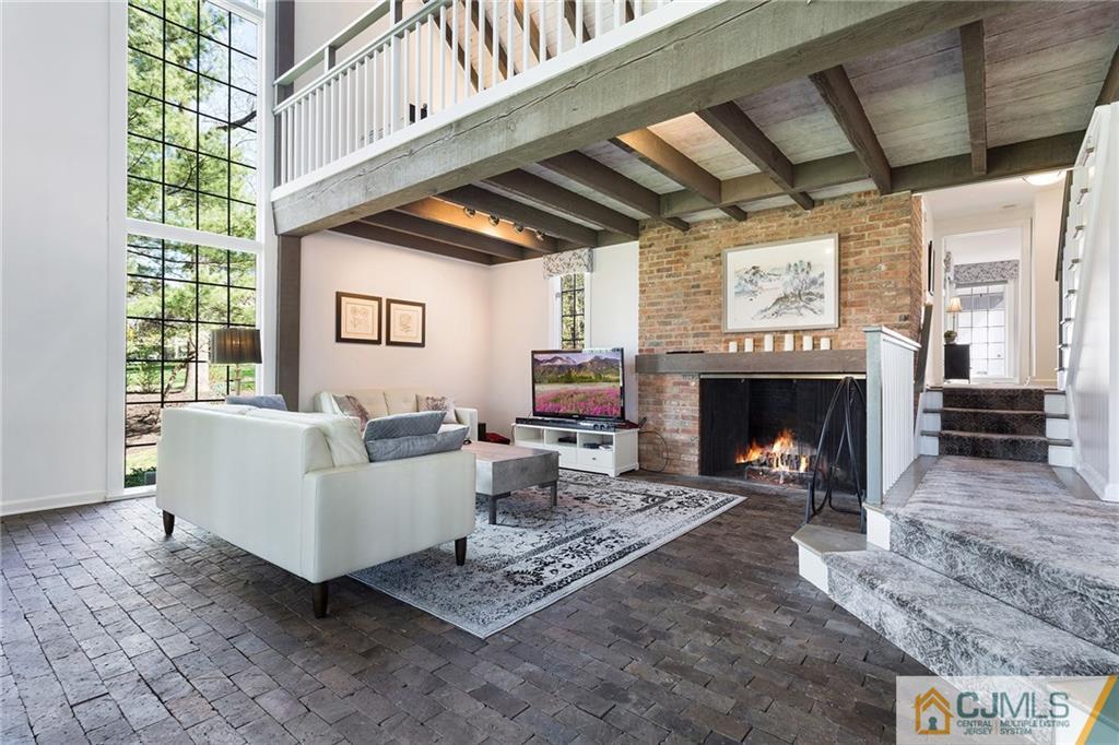109 Rolling Hill Road Skillman, NJ 08558 - Photo 6 of 25 a living room with furniture and a fireplace