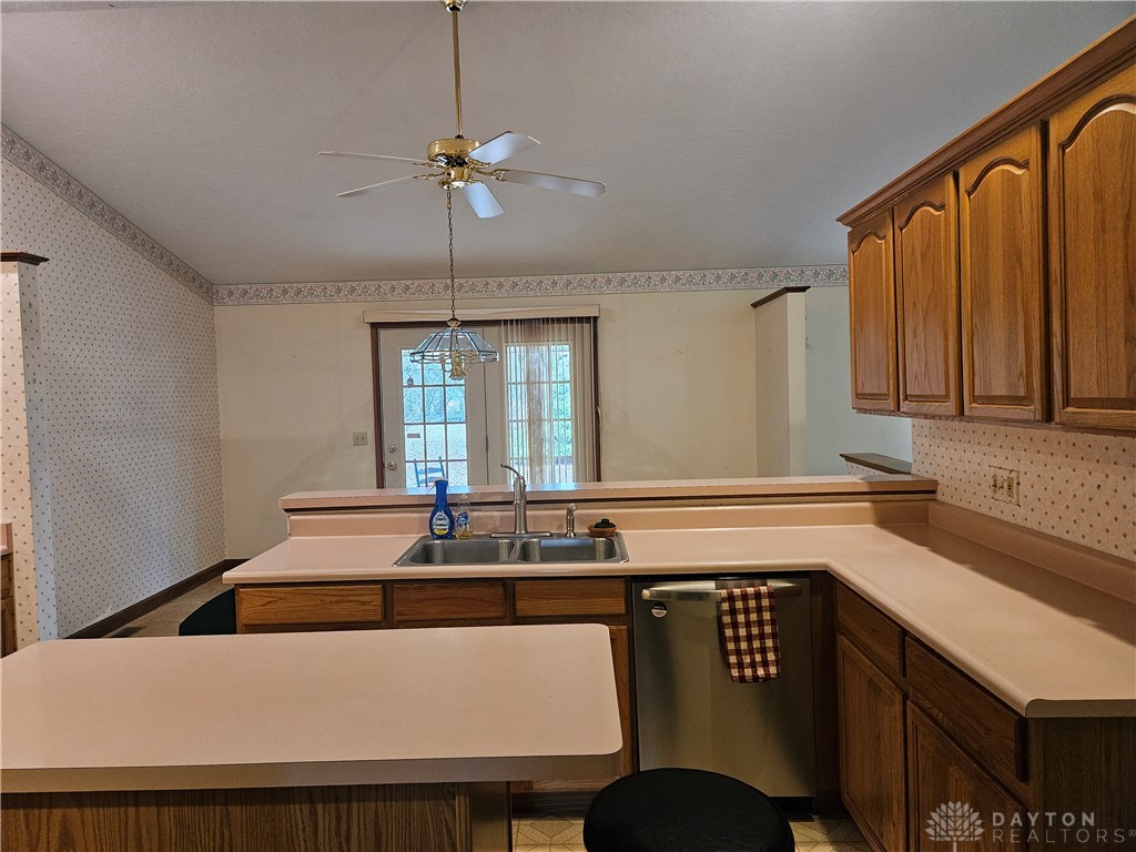 4909 Shannon Avenue Springfield, OH 45504 - Photo 8 of 21 This spacious kitchen offers ample counter space, a double sink, and easy access to the outdoors.