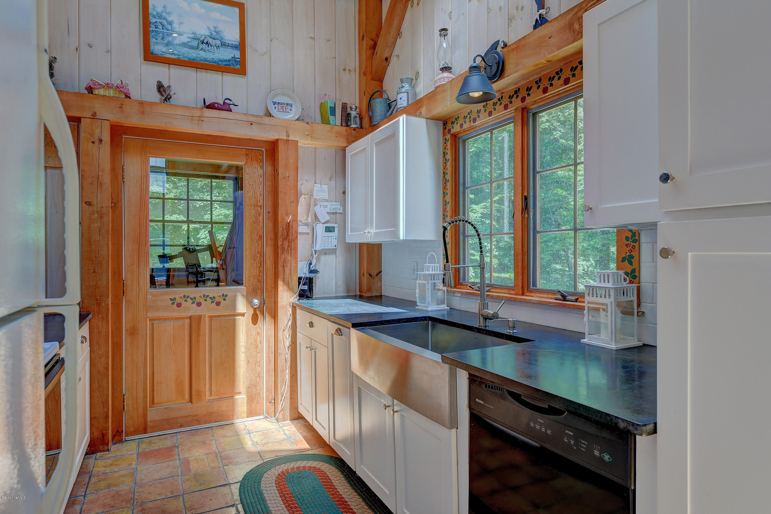 726 North Main Road Otis, MA 01253 - Photo 11 of 30 a kitchen with stainless steel appliances a sink and a refrigerator