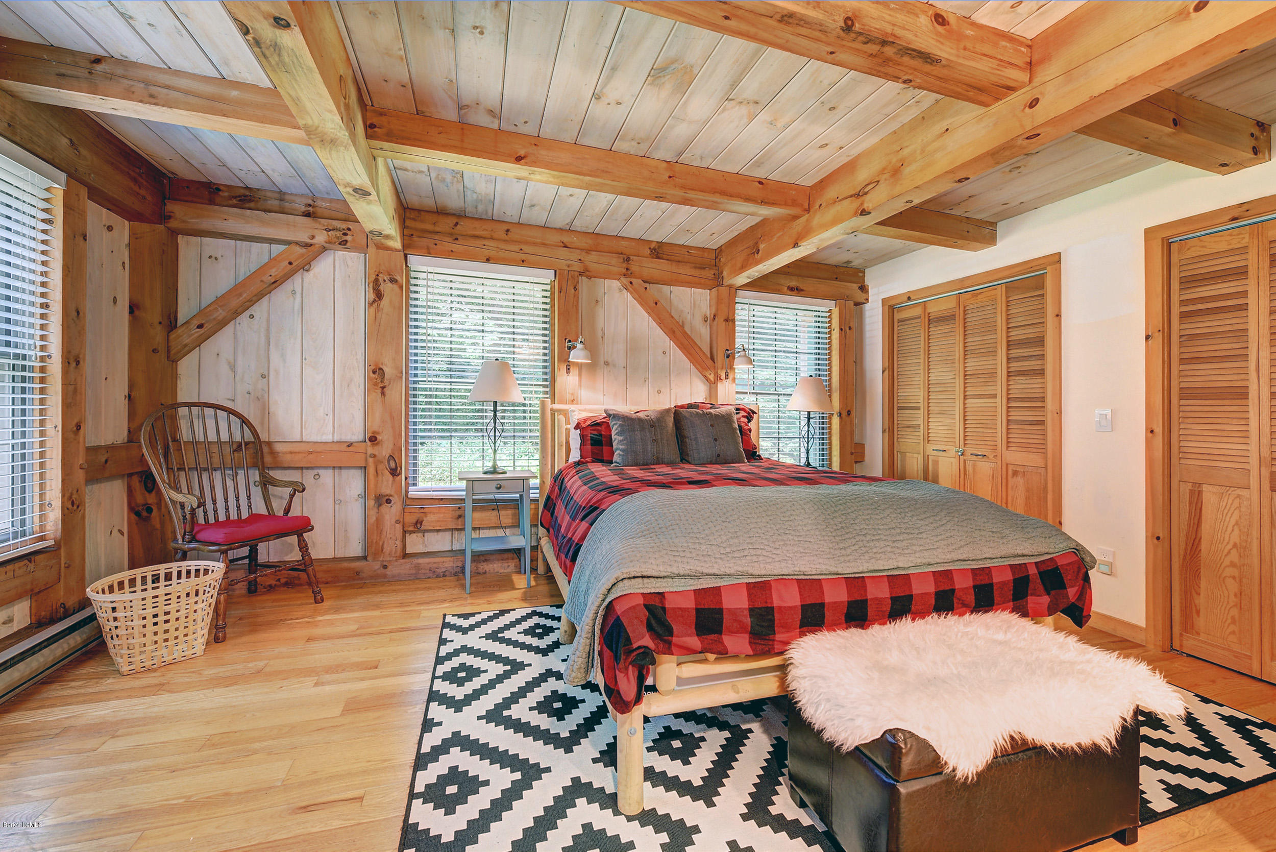 726 North Main Road Otis, MA 01253 - Photo 13 of 30 a bed sitting in a bedroom next to a window
