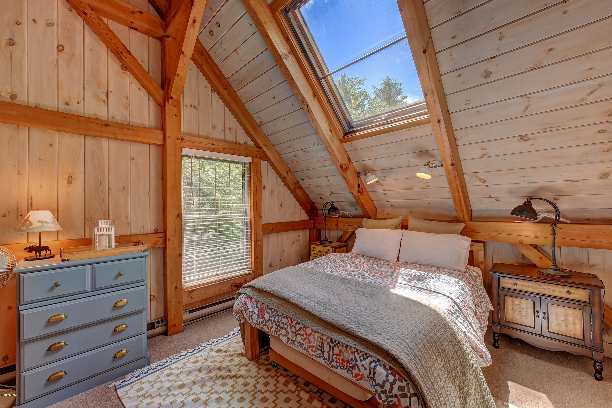 726 North Main Road Otis, MA 01253 - Photo 19 of 30 a bedroom with a bed a dresser next to a window