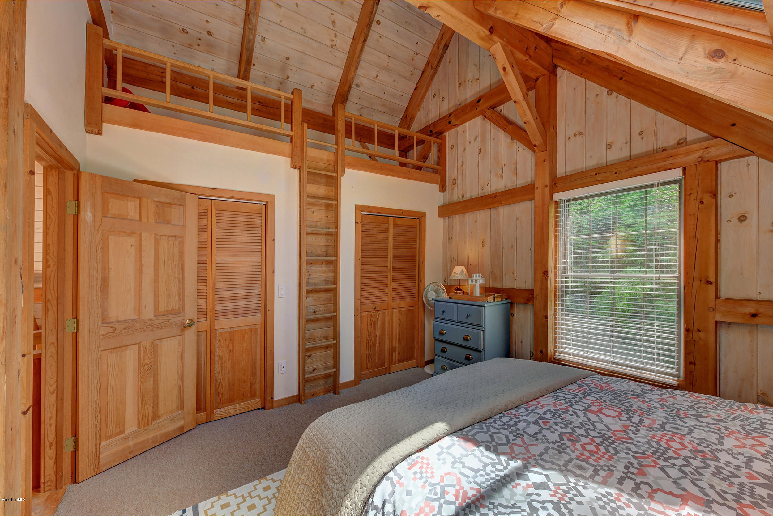 726 North Main Road Otis, MA 01253 - Photo 20 of 30 a bedroom with a bed and wooden floor